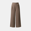 Yellow FJØRNA Liam women's high waist wide-leg pants in cotton linen with pockets, featuring a plain color and relaxed fit.