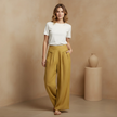 FJØRNA Liam women’s high waist wide leg pants in yellow cotton linen with pockets, stylish and comfortable for casual wear.