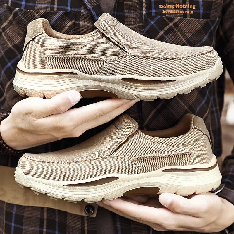 Blue FJØRNA men's orthopedic slip-on loafers made from breathable canvas, designed for comfortable everyday wear.