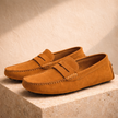 Brown men's FJØRNA loafers, classic Italian casual shoes, featuring sleek design and comfortable fit for everyday wear.