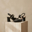 Red FJØRNA women's orthopedic heels with a sleek design and comfortable sole, perfect for stylish support and everyday wear.