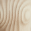 Beige FJØRNA long sleeve women's ruffle sweater, stylish knit top with a cozy fit and elegant design.