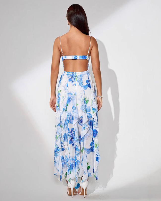 White Ruffle Hem Midi Dress by FJØRNA with floral print, spaghetti straps, ruffle details, and a slit at the back.