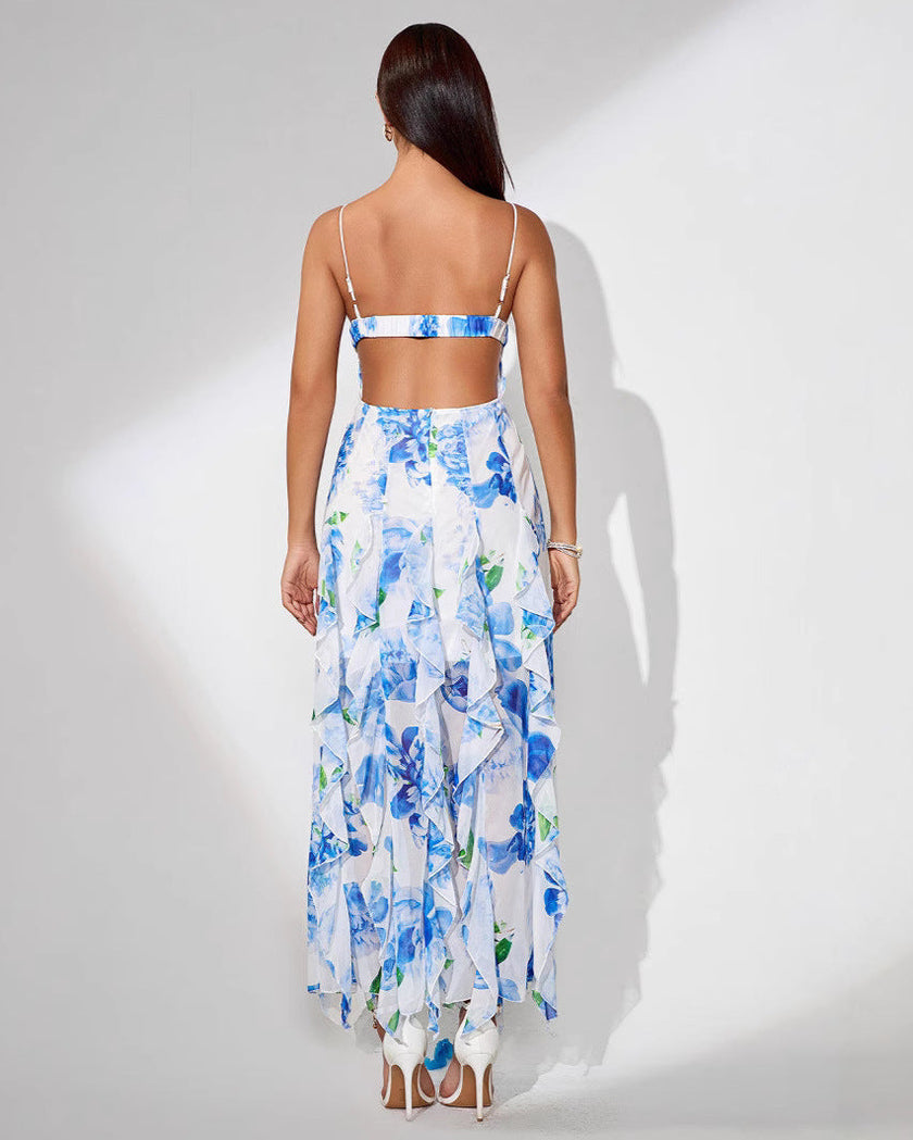 White Ruffle Hem Midi Dress by FJØRNA with floral print, spaghetti straps, ruffle details, and a slit at the back.