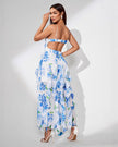 FJØRNA white ruffle hem midi dress with floral pattern, spaghetti straps, and slit detail, perfect for elegant summer occasions.