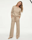 FJØRNA women's joggers, stylish and comfortable pants for women, shown in a casual outfit on a model.