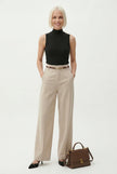 FJØRNA women's wool wide-leg high-waist trousers displayed on a model, showcasing a stylish and comfortable pants fit.