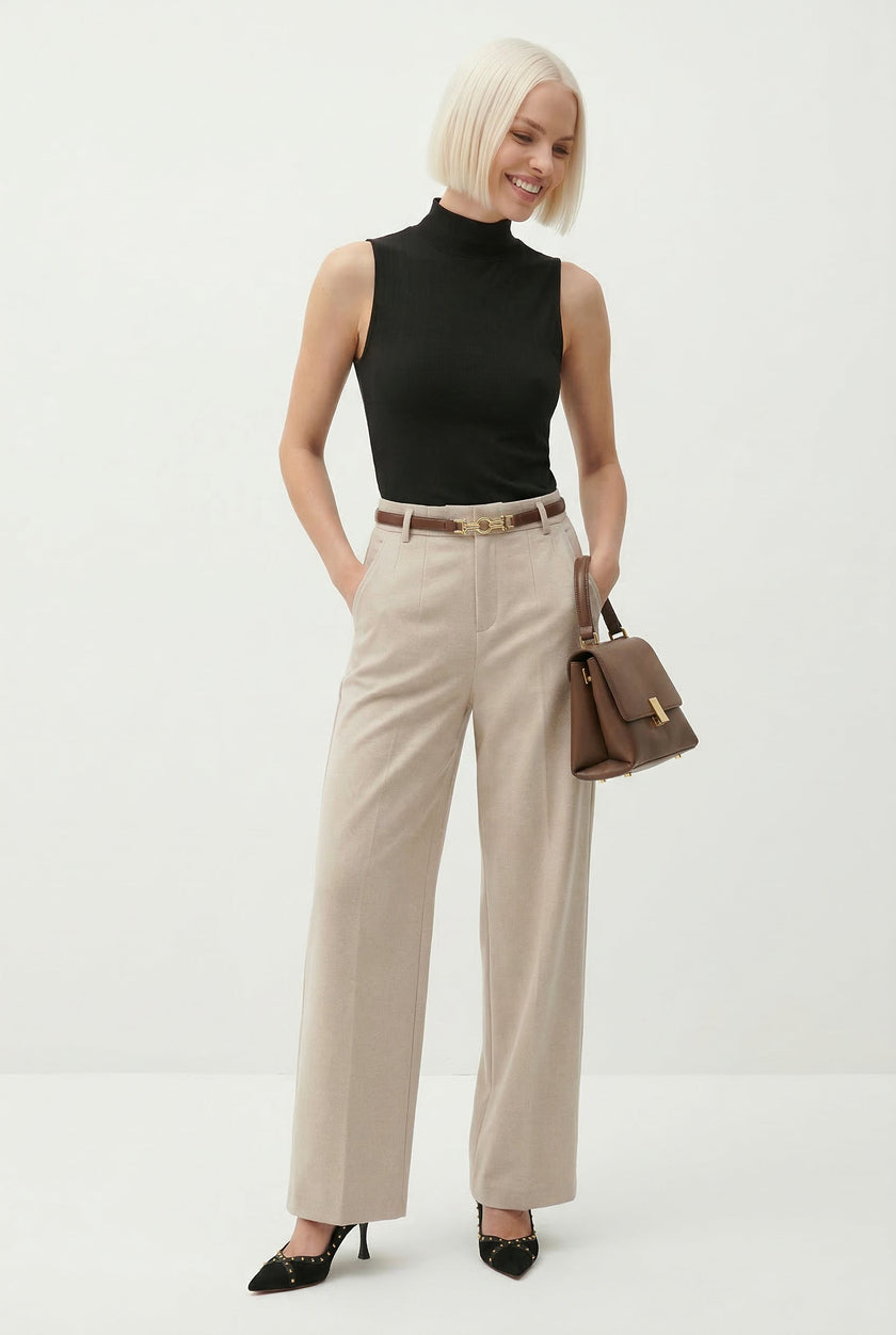 FJØRNA women's wool wide-leg high waist trousers displayed on a model, showcasing a stylish and comfortable pant design.