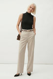 FJØRNA women's wool wide-leg high-waist trousers styled on a model, showcasing a tailored, elegant fit.