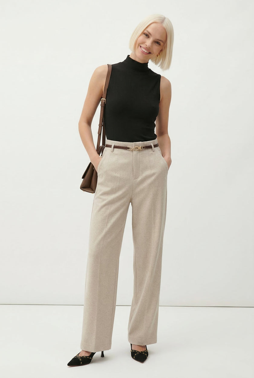 FJØRNA women's wool wide-leg high-waist trousers styled on a model, showcasing a tailored, elegant fit.