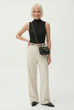 FJØRNA women's wool trousers with wide leg and high waist, styled as elegant, tailored pants for a sophisticated look