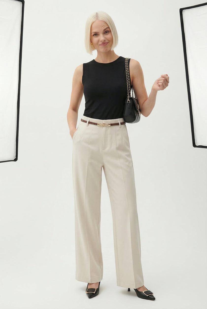 FJØRNA women's wool wide-leg high-waist trousers displayed on a mannequin, showcasing a stylish and comfortable pant style.