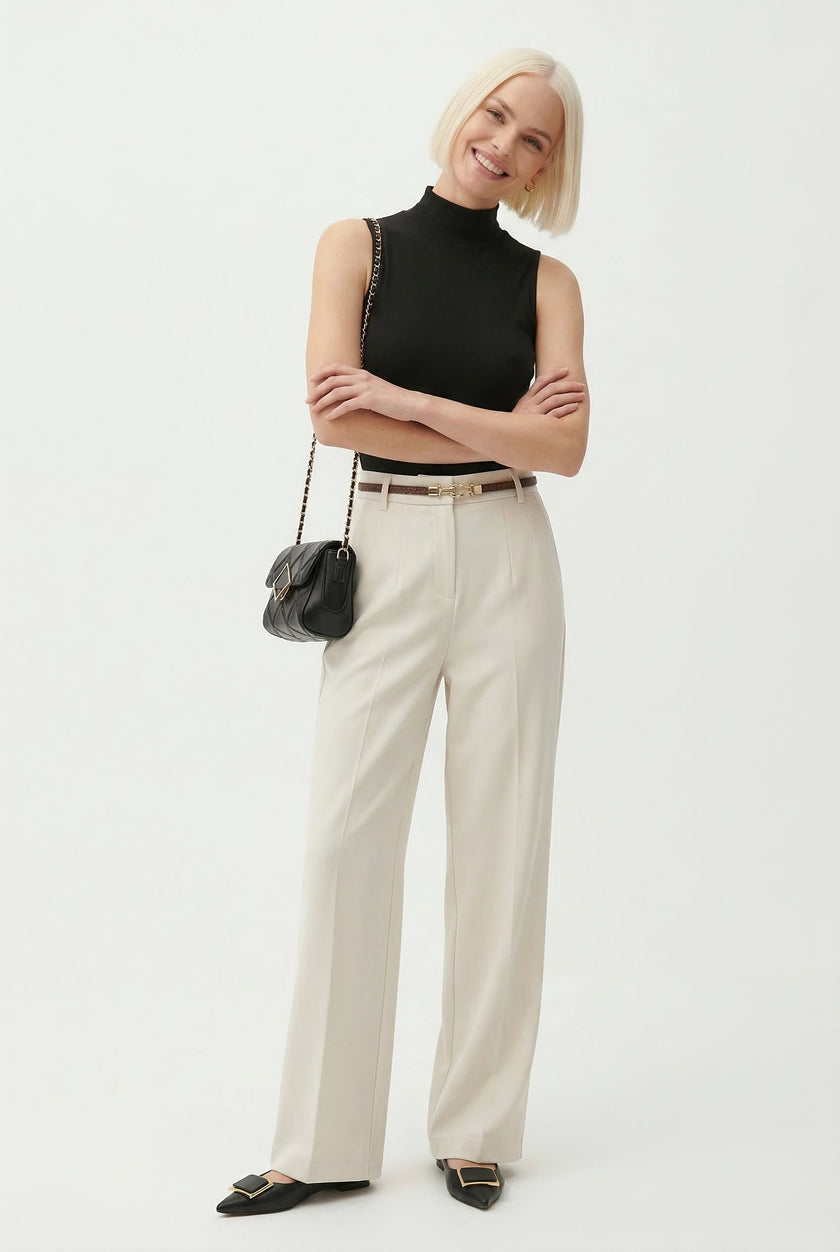 FJØRNA women's wide-leg high-waist wool trousers styled for a modern, elegant look with a tailored fit.
