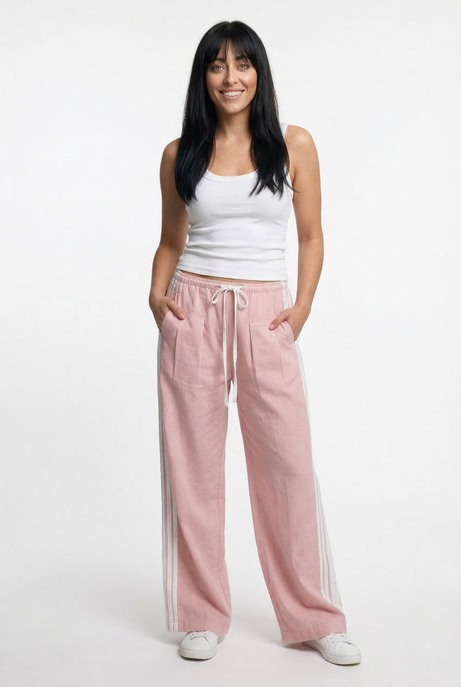 High waist FJØRNA cotton joggers for women, elastic waistband and comfortable fit, shown on a woman with a casual outfit.