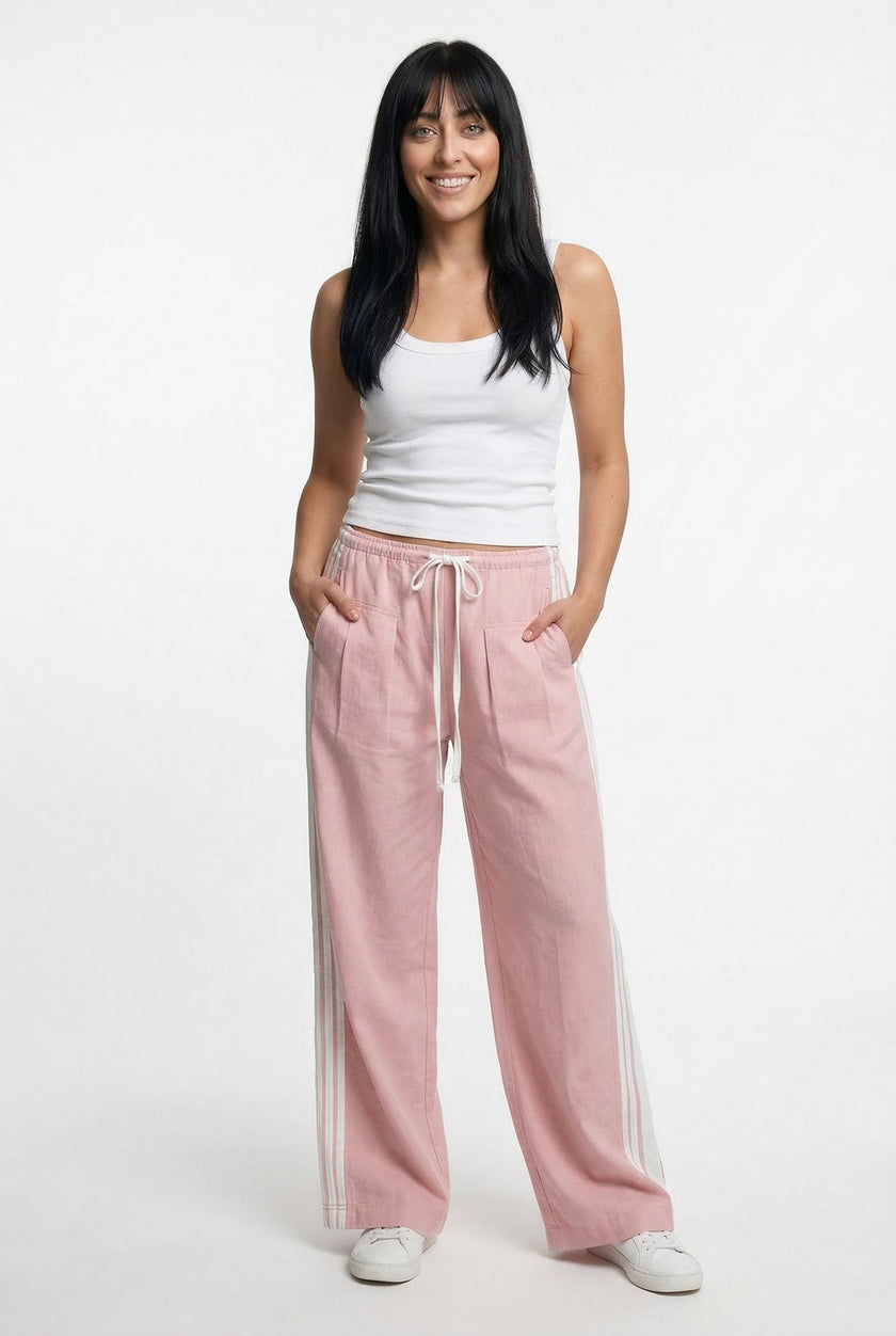 High waist FJØRNA cotton joggers for women, elastic waistband and comfortable fit, shown on a woman with a casual outfit.