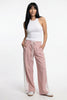 Women’s high waist cotton joggers by FJØRNA, elastic waistband and relaxed fit, shown on a person in a casual outfit.