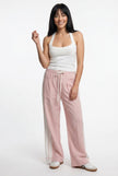 FJØRNA women's high-waist cotton joggers with elastic waistband, casual pants shown on a model in a relaxed outfit.