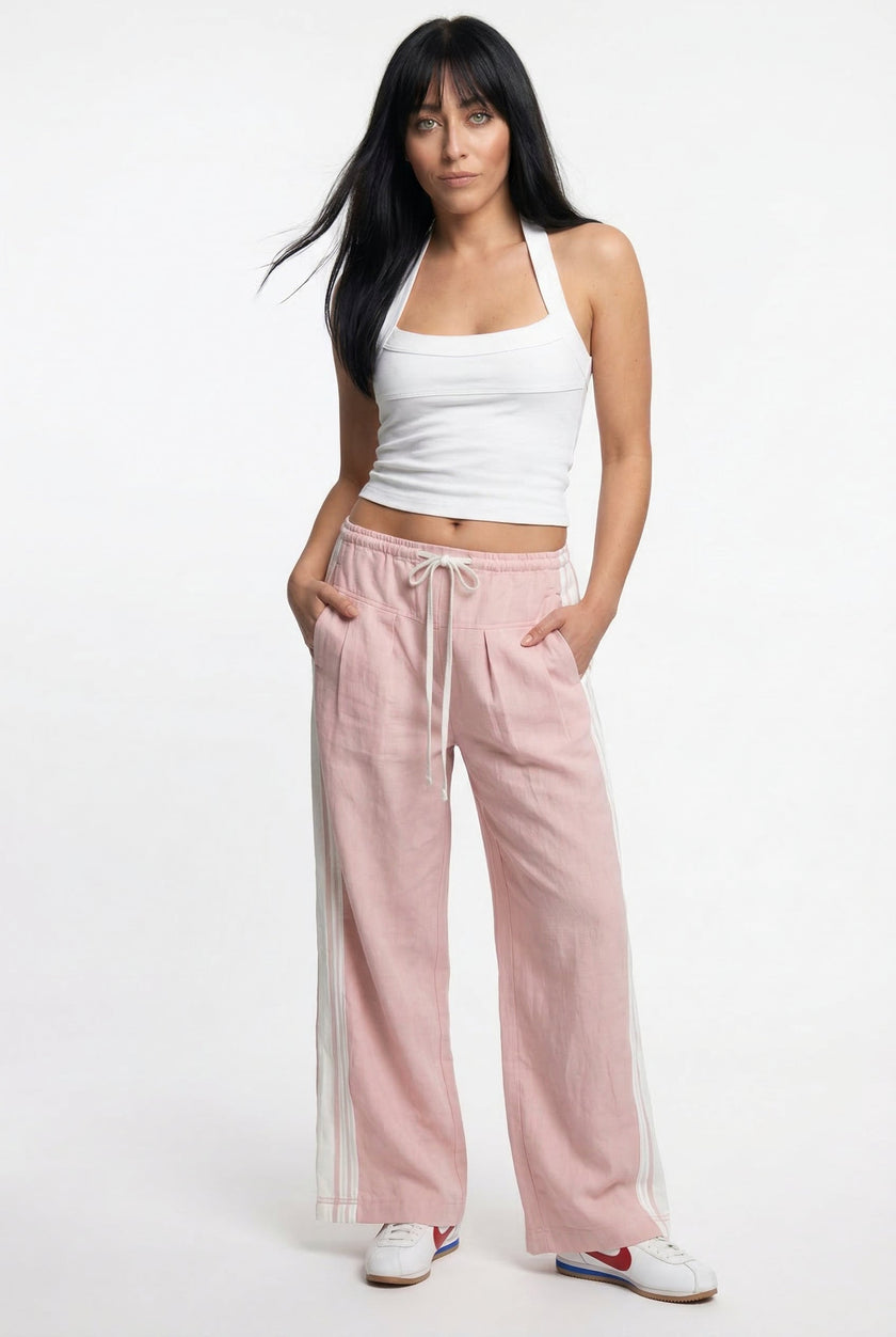 Women’s high waist cotton joggers by FJØRNA, featuring elastic waistband and comfortable fit, shown on a model.