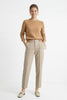 FJØRNA women's wool tapered trousers, stylish pants for women, shown in a modern outfit with a clean, tailored fit.