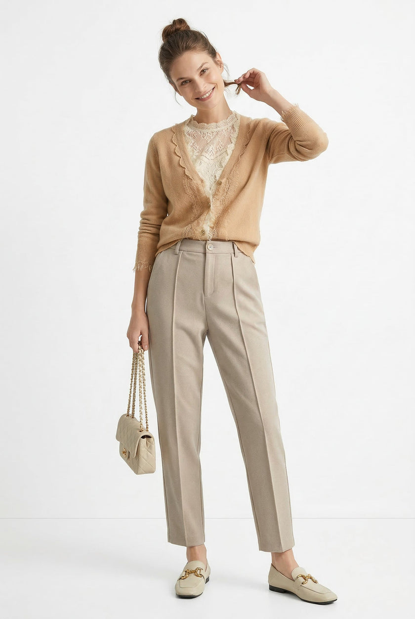 Women’s wool tapered trousers by FJØRNA, showcasing a stylish fit and cozy fabric, ideal for casual or professional outfits.