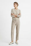 Women’s tapered wool trousers by FJØRNA, showcasing stylish and comfortable pants with a tailored fit.