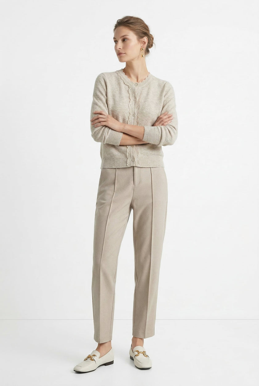 Women’s tapered wool trousers by FJØRNA, showcasing stylish and comfortable pants with a tailored fit.