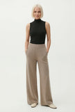FJØRNA women's joggers, stylish and comfortable pants for women, shown in a casual outfit on a model.