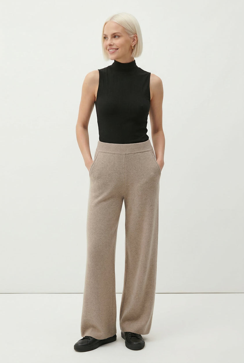 FJØRNA women's jogger pants in a casual fit, shown in a relaxed stance with soft fabric and modern design.