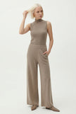 FJØRNA women's jogger pants featuring a comfortable, casual fit in a neutral color, ideal for everyday wear.