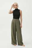 FJØRNA women's knit wide-leg trousers with elastic waist, comfortable and stylish pants for women, shown in a casual outfit.