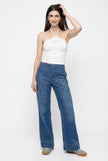 Women’s wide-leg denim jeans by FJØRNA, featuring a relaxed fit and classic blue denim fabric.