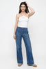 Women’s wide-leg denim jeans by FJØRNA, featuring a relaxed fit and classic blue denim fabric.