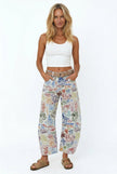 Women’s wide-leg denim jeans by FJØRNA, featuring a relaxed fit and classic blue denim fabric, shown on a model.