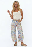 Women’s wide-leg denim jeans by FJØRNA, featuring a relaxed fit and classic blue wash, shown on a model in a casual outfit.