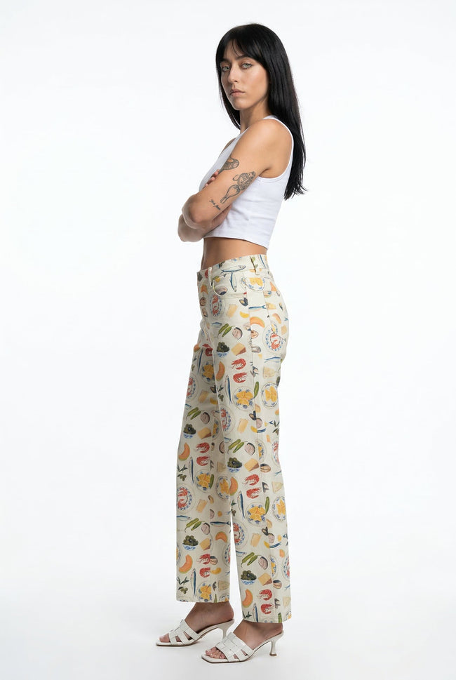 FJØRNA women's denim jeans, stylish pants featuring classic blue denim, front pockets, and a fitted design on a model.