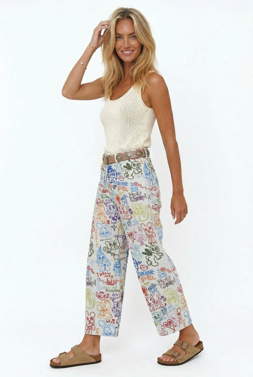 FJØRNA women's wide-leg denim jeans, stylish pants with a relaxed fit, shown on a model in a casual outfit.