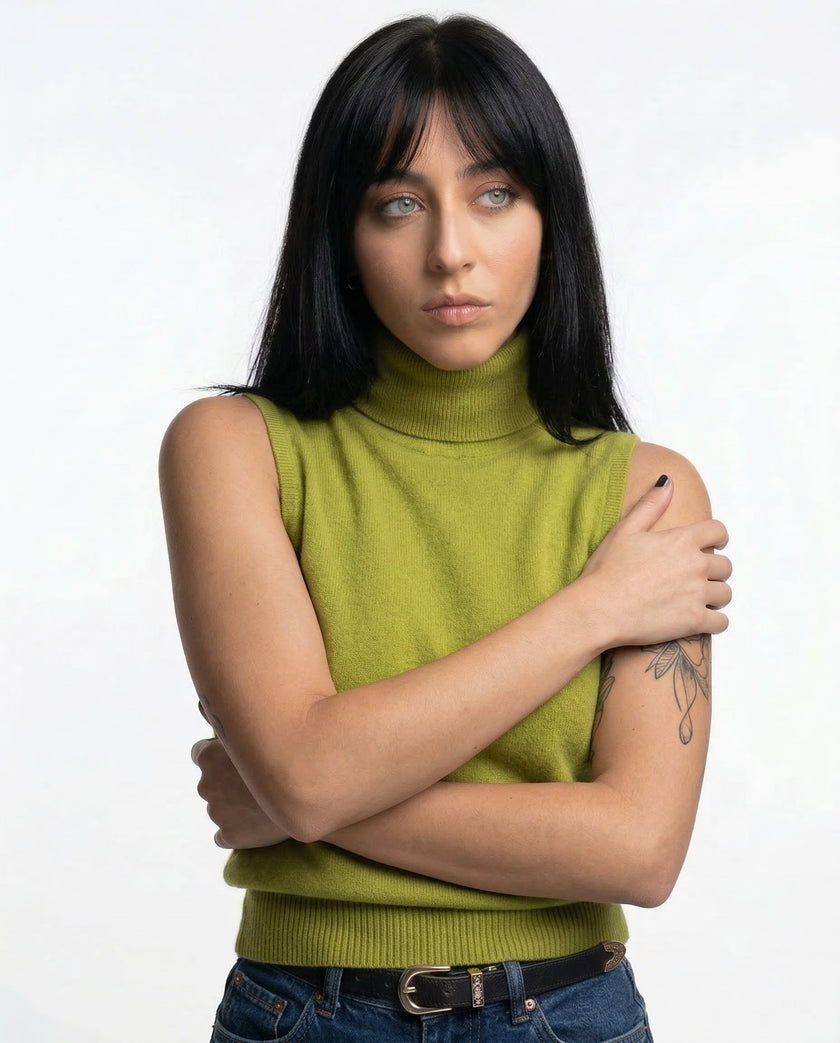 FJØRNA women's sleeveless wool vest, soft and cozy top, shown in a neutral color on a model.