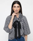 FJØRNA women's cotton blouse with ruffle detail, stylish and lightweight top perfect for casual or dressy occasions.