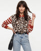 Women’s cotton cardigan by FJØRNA, soft and lightweight, shown as a stylish top in a natural, relaxed fit.