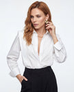 FJØRNA women's cotton blouse, stylish white top with a relaxed fit, displayed on a model for casual or business wear.