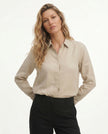 FJØRNA women's linen blouse with a relaxed fit, featuring long sleeves and a soft, breathable fabric, perfect for casual wear.