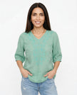 FJØRNA women's cotton V-neck blouse, light-colored top with soft fabric and relaxed fit, ideal for casual or office wear