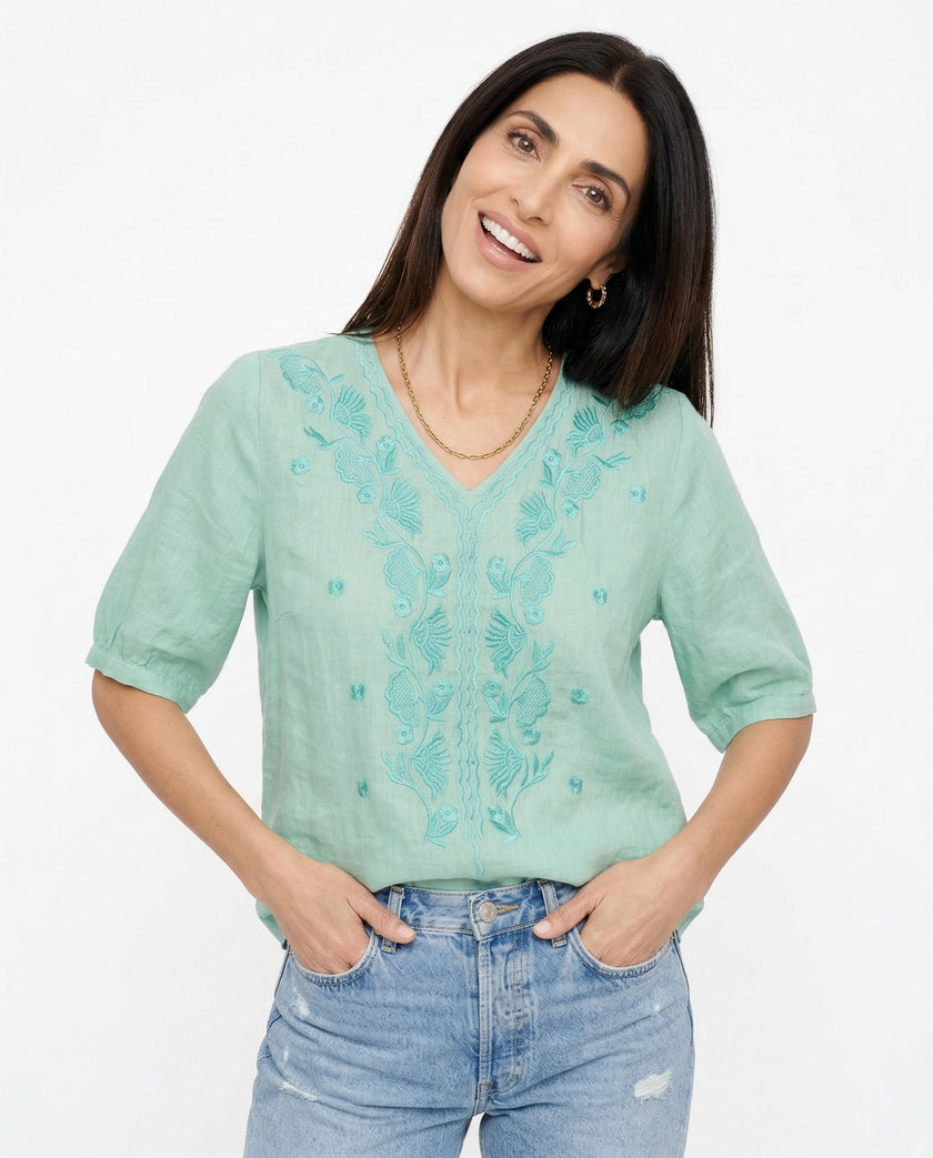 FJØRNA women's cotton V-neck blouse with long sleeves, featuring a relaxed fit and classic design, perfect for casual or office wear.