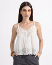FJØRNA women's lace cami top with trimmed details, featuring delicate lace fabric and a stylish, fitted design.