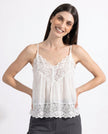 FJØRNA women's lace cami top with trim, featuring delicate lace and lightweight fabric, perfect for casual or dressy occasions.