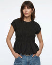 FJØRNA women's linen peplum blouse with short sleeves and a relaxed fit, featuring a stylish, lightweight design.