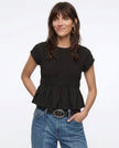 Women’s linen top with ruffle details from FJØRNA, featuring a lightweight, breathable design perfect for casual wear.