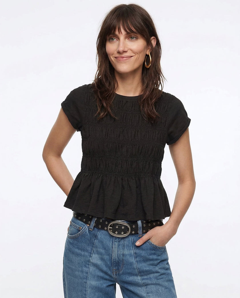 Women’s linen top with ruffle details from FJØRNA, featuring a lightweight, breathable design perfect for casual wear.
