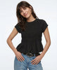 FJØRNA linen peplum blouse for women, stylish and lightweight top with a fitted waist and elegant design, shown on a model.