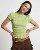 Women’s plaid top with ruffle details by FJØRNA, featuring a stylish and casual design perfect for everyday wear.